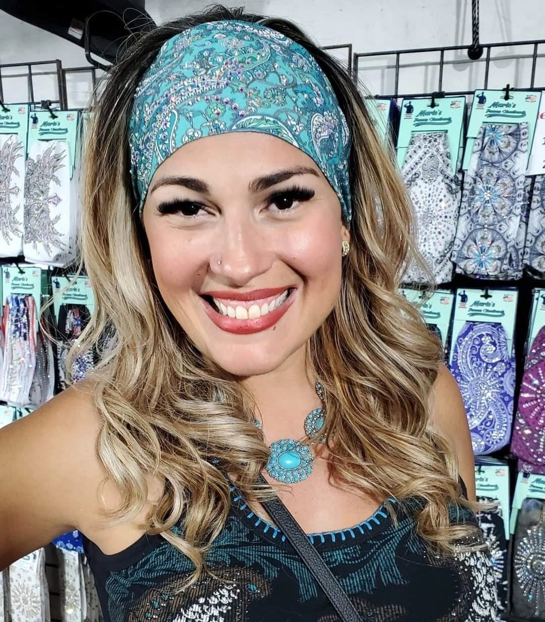Close-up of rhinestone cross design headband.