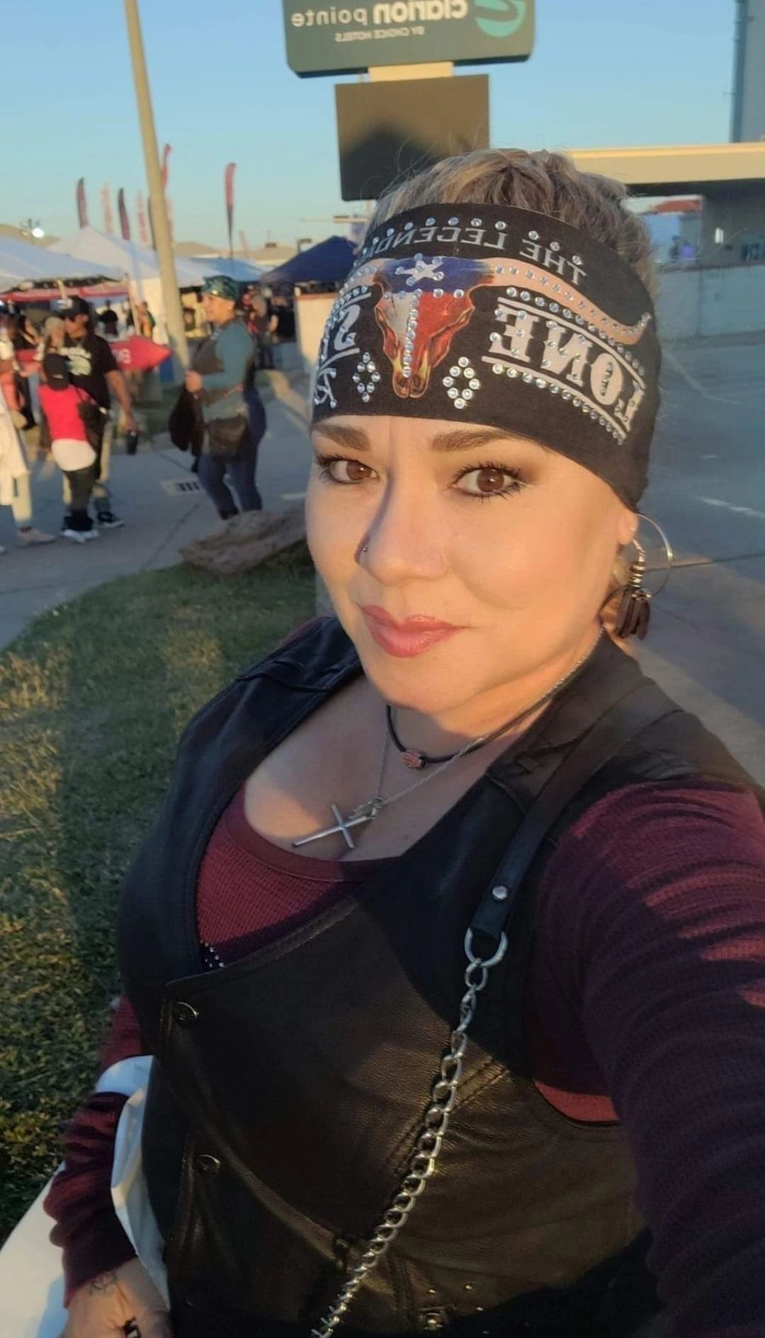 Rally visitors trying on Marie's Famous Headbands.
